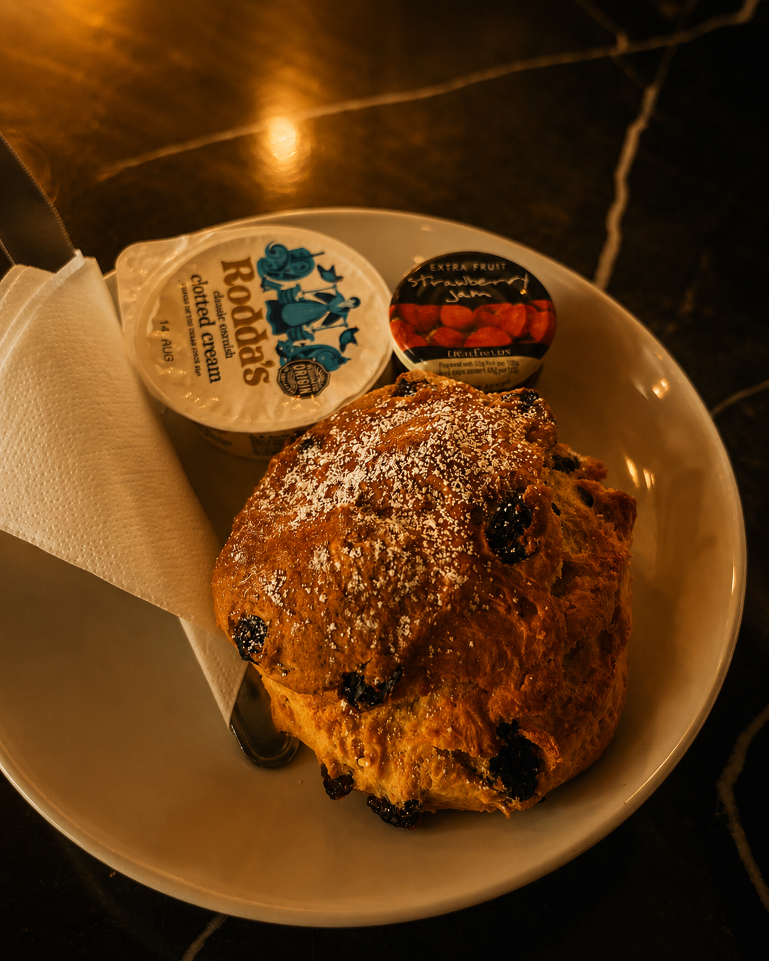Scone served with clotted cream and jam